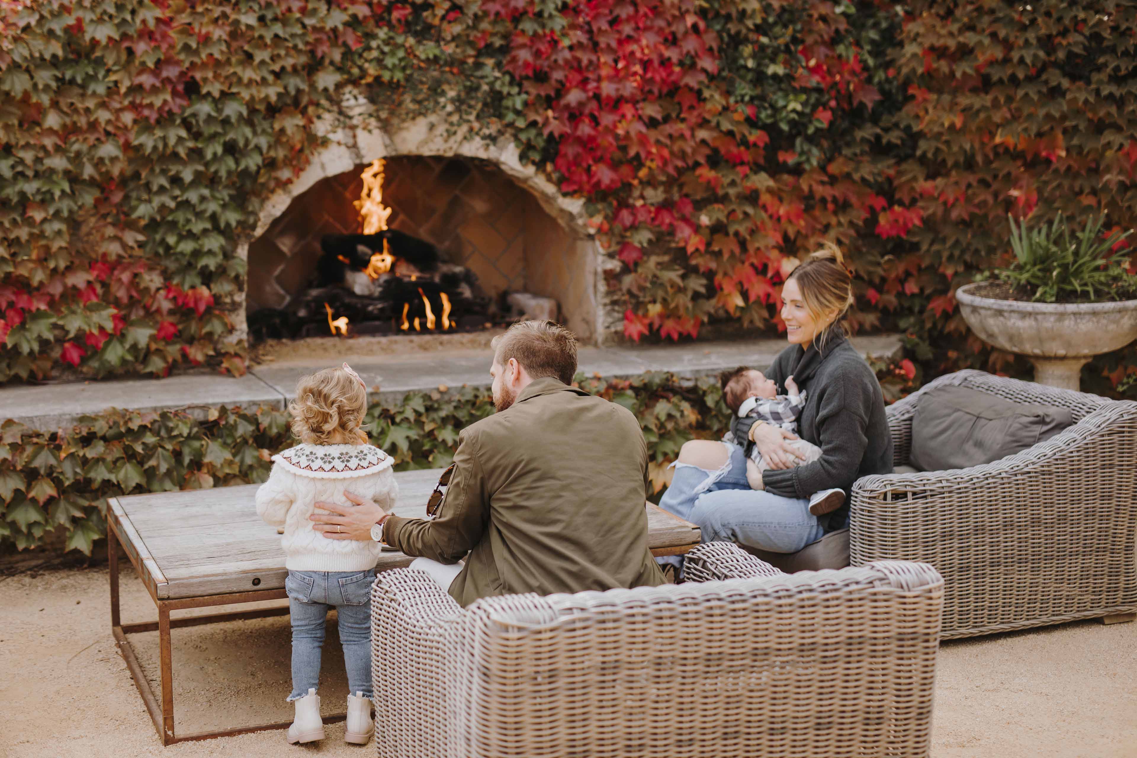 family around fireplace